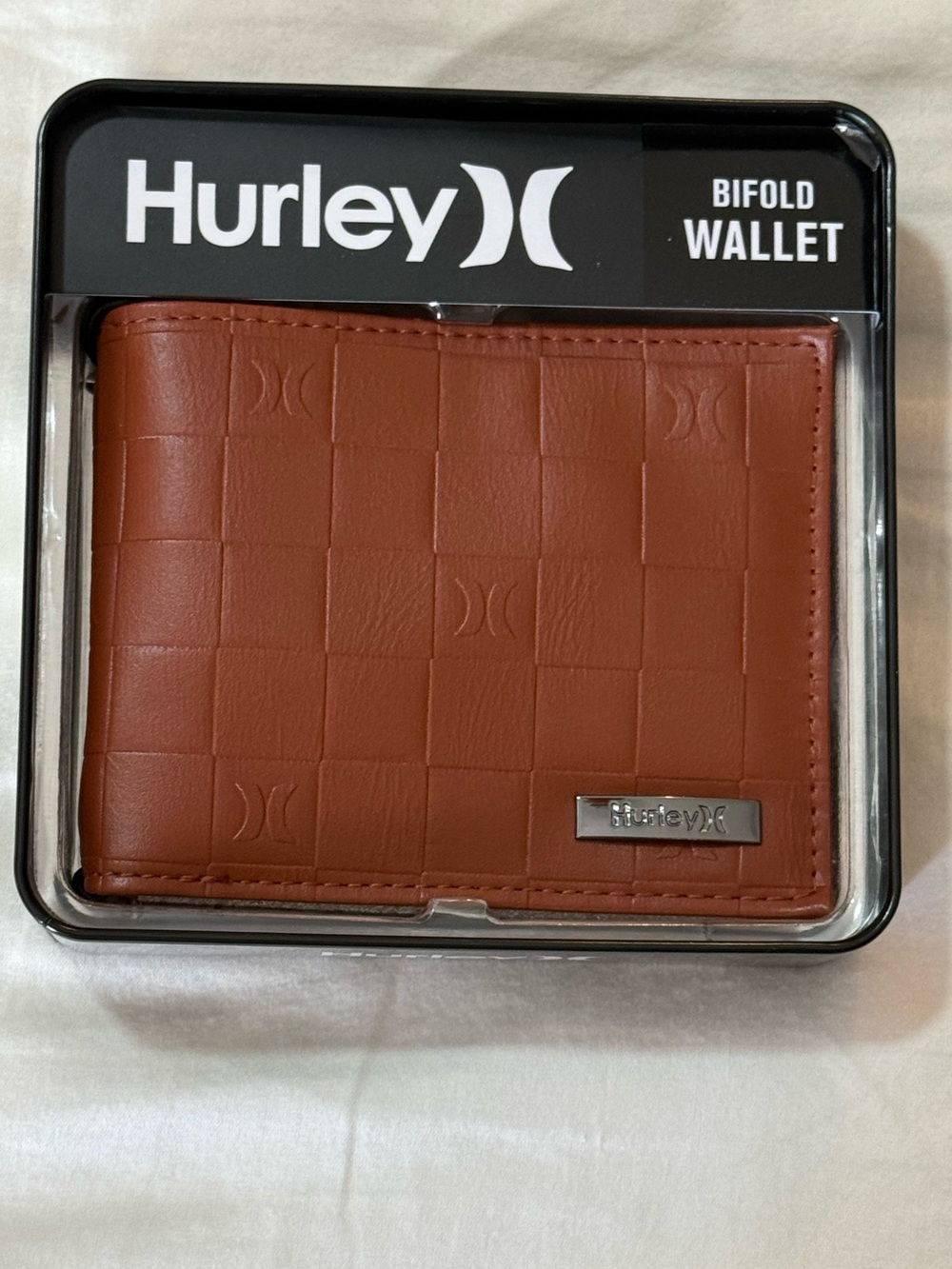 Hurley Cognac Bi-fold Wallet. New with Tags. Comes in decorative tin.